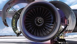 Roda de um avião com cores em azul, cinza e rosa em espiral, ilustrando o uso dos lubrificantes Mobil em produtos de alta tecnologia